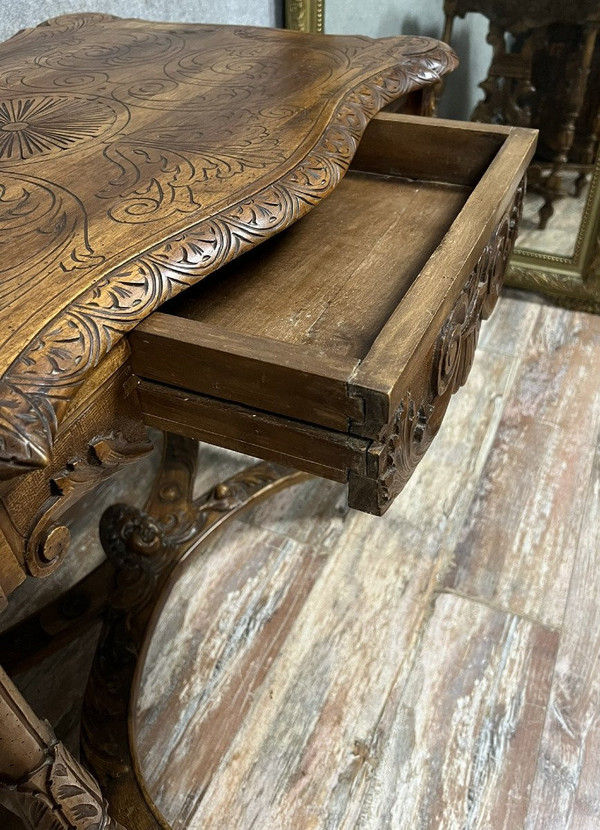 double-sided Renaissance desk in walnut carved with plant motifs