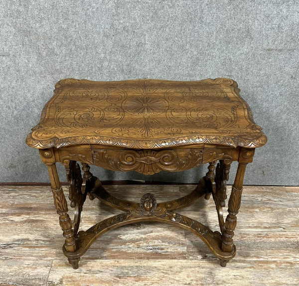 double-sided Renaissance desk in walnut carved with plant motifs