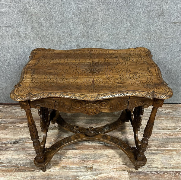 double-sided Renaissance desk in walnut carved with plant motifs