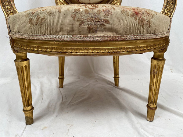 Louis XVI style giltwood armchair, late 19th or early 20th century