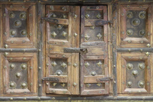 Asian wooden furniture inlaid with brass buttons and plates 