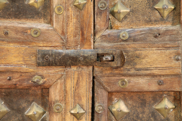 Asian wooden furniture inlaid with brass buttons and plates 