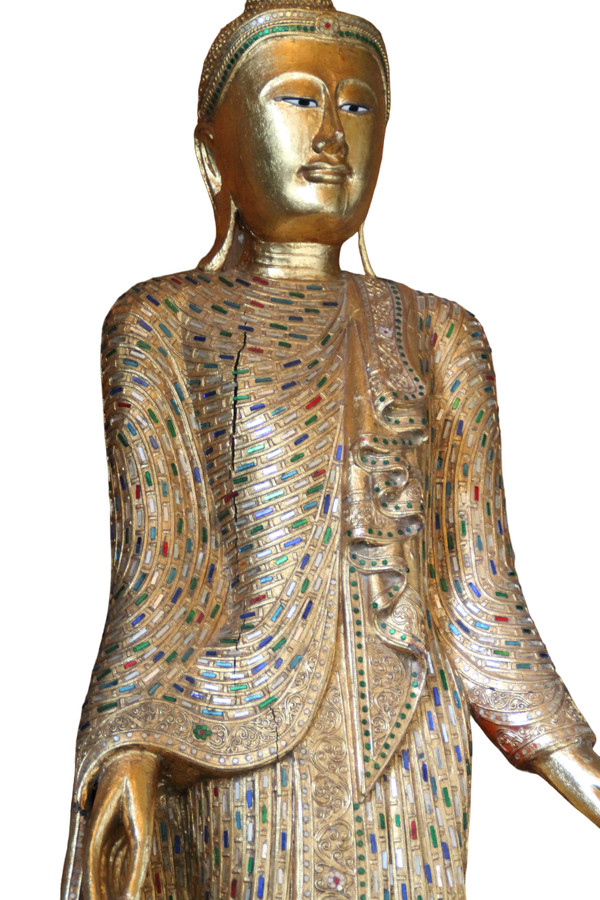 A large standing Buddha in gilded and inlaid wood, Thailand, 20th century 