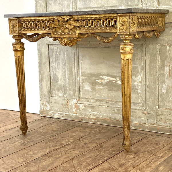 Louis XVI period console in gilded wood