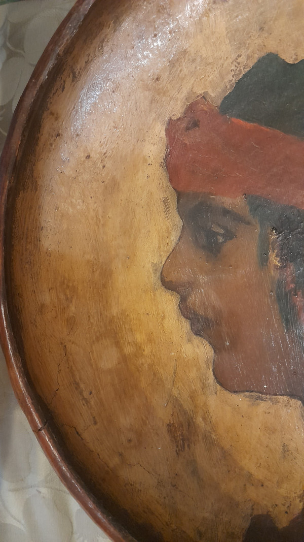 Portrait of a young orientalist woman painted on terracotta dish circa 1900/1930