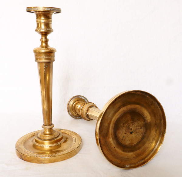 Pair of Empire period gilt bronze candlesticks / torches attributed to Claude Galle