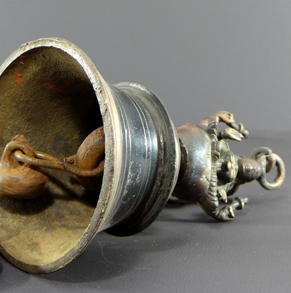 India, Mid-20th Century, Bronze bell adorned with a representation of the goddess Tripura.