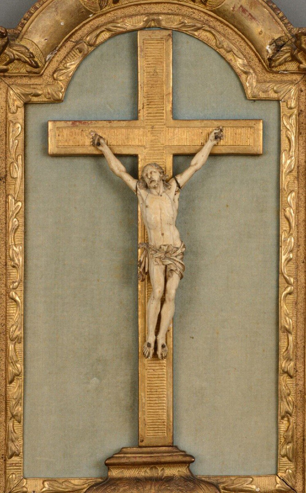 18th-century hand-carved Christ, gilded wood frame, floral decoration