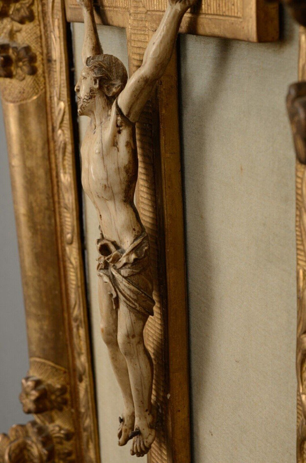 18th-century hand-carved Christ, gilded wood frame, floral decoration