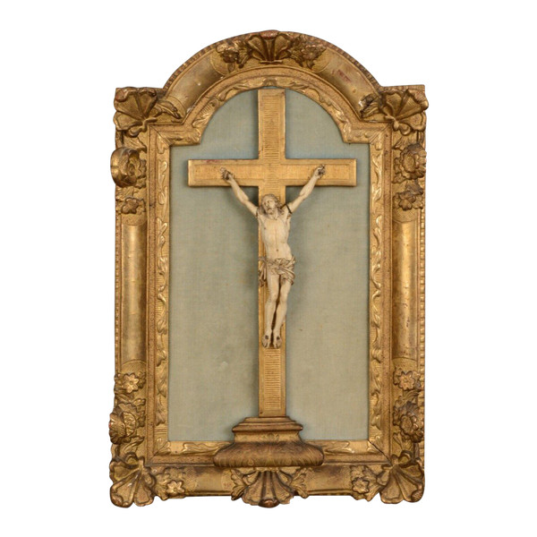 18th-century hand-carved Christ, gilded wood frame, floral decoration