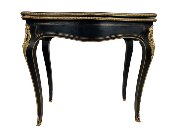 Napoleon III console forming a games table, blackened wood and brass marquetry