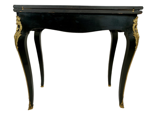 Napoleon III console forming a games table, blackened wood and brass marquetry