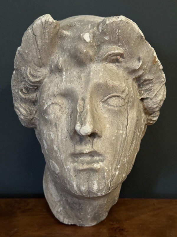 Antique plaster sculpture of a female face from the early 20th century