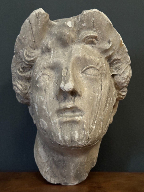 Antique plaster sculpture of a female face from the early 20th century