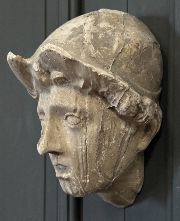 Antique plaster sculpture of a female face from the early 20th century