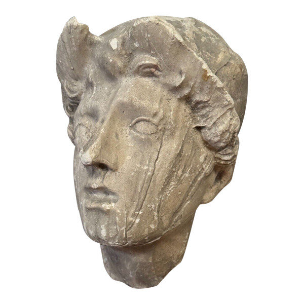 Antique plaster sculpture of a female face from the early 20th century