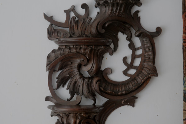  Carved oak wall lamp in the Louis XV rocaille style.