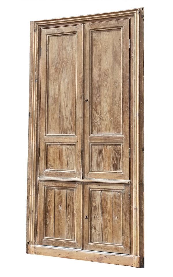 Two antique double cupboard doors in noble wood with their front woodwork frame