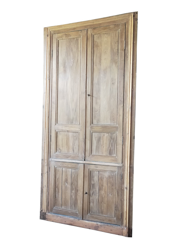 Two antique double cupboard doors in noble wood with their front woodwork frame