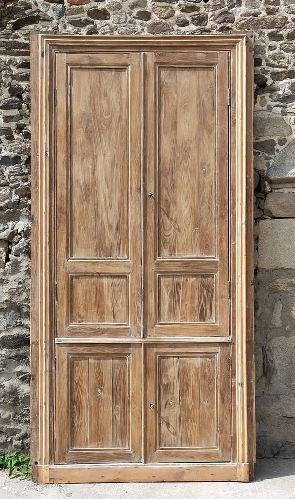 Two antique double cupboard doors in noble wood with their front woodwork frame