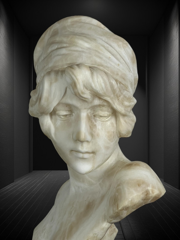 LARGE BUST OF A YOUNG GIRL SIGNED AND NUMBERED "GEORGES MORIN" IN ALABASTER