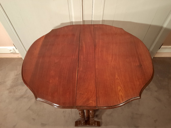 Louis-Philippe period mahogany side table with two folding leaves.