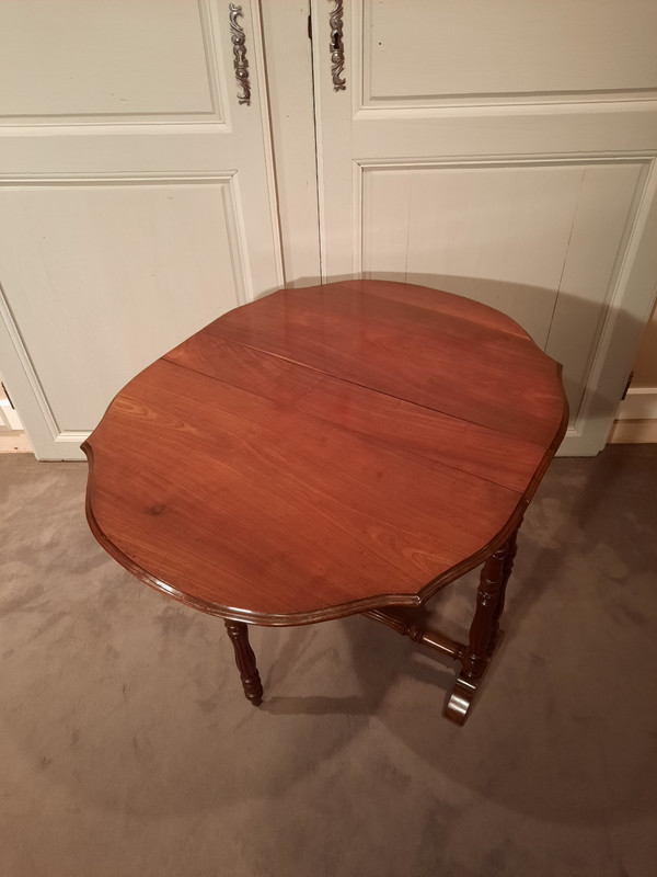 Louis-Philippe period mahogany side table with two folding leaves.