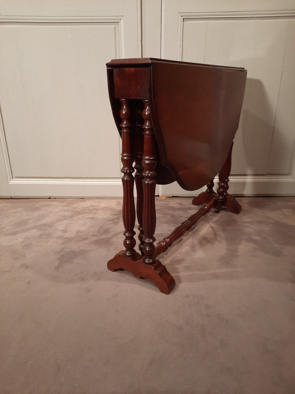 Louis-Philippe period mahogany side table with two folding leaves.