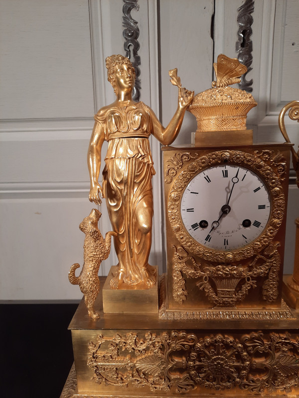 Empire period gilt bronze clock on the theme of peace and fidelity.