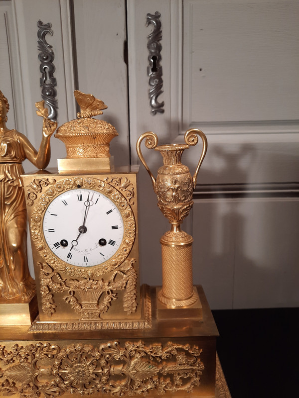 Empire period gilt bronze clock on the theme of peace and fidelity.