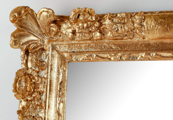 A French Regence period carved and gilt wood and stucco mirror circa 1720