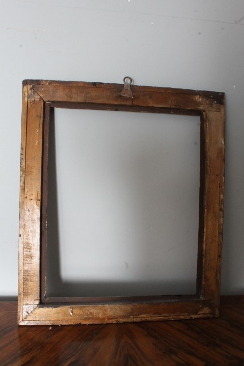 Antique 17th-era painted frame in carved and lacquered wood. Exterior 91.50 x 79 . Interior 75.7 x 6