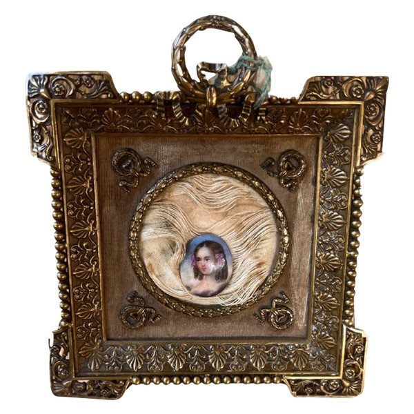 Bronze and brass frame with porcelain medallion