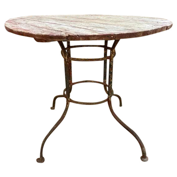 Wrought iron garden table with round top