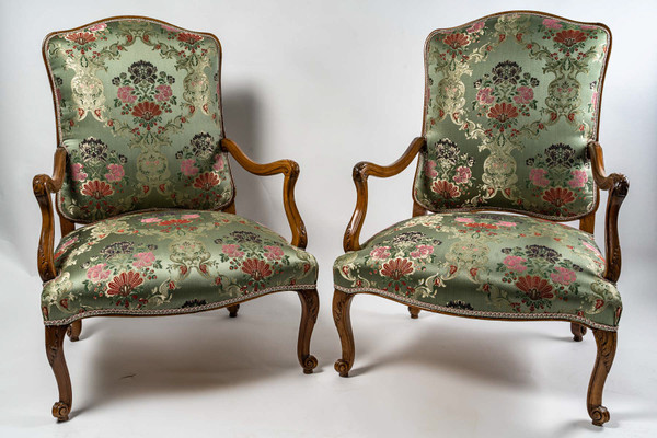 French Regence period circa 1720 Pair of large molded and carved walnut armchairs