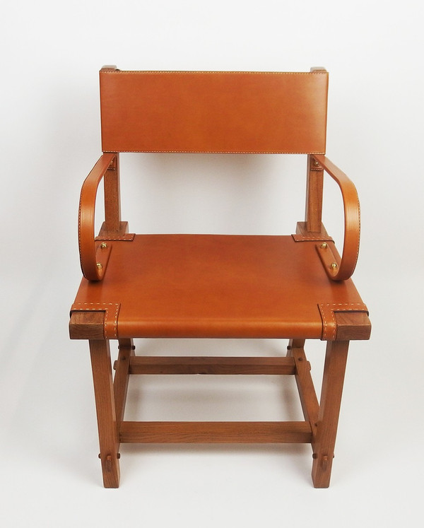 Leather armchair by Jacques Adnet