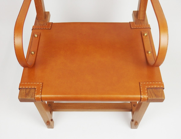 Leather armchair by Jacques Adnet