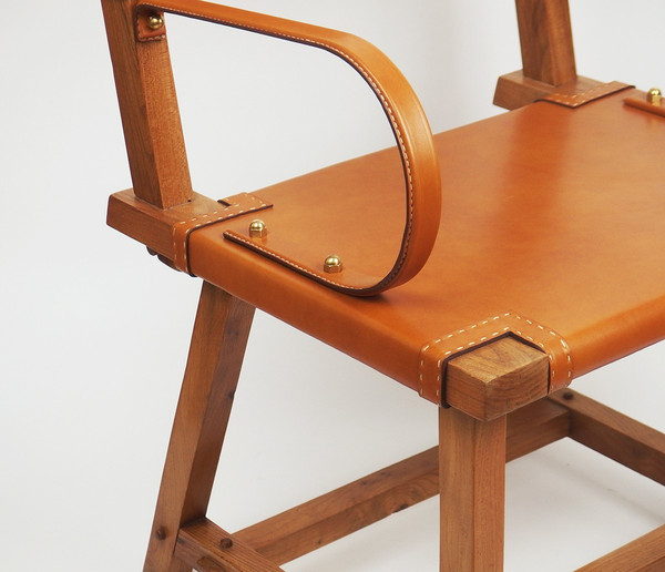 Leather armchair by Jacques Adnet