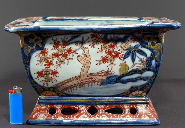 Japan, Late 19th Century, Imari Port, Porcelain Jardiniere Decorated With Animated Landscapes.