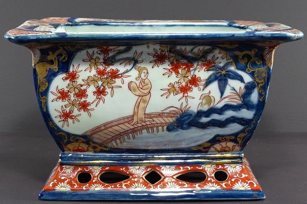 Japan, Late 19th Century, Imari Port, Porcelain Jardiniere Decorated With Animated Landscapes.