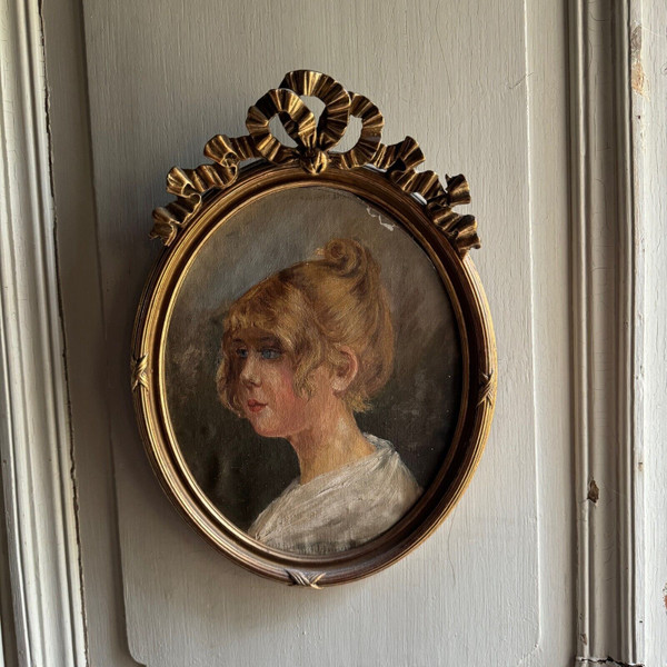 Oil on cardboard portrait of a young girl with blond hair, early 20th century