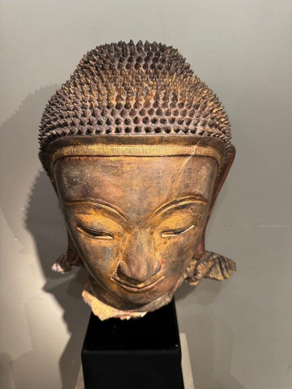 Large gilded terracotta Buddha head, Burma, Shan states, late 18th century.