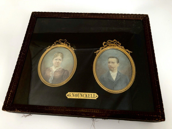 Pair of late 19th century couple miniatures by Georgine Nounckele bronze frame