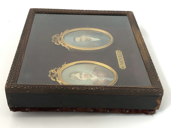 Pair of late 19th century couple miniatures by Georgine Nounckele bronze frame