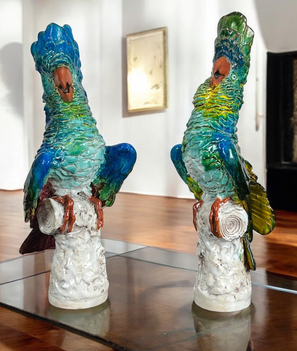 PAIR OF POLYCHROME GLAZED CERAMIC COCKATOOS BEARING A SIGNATURE