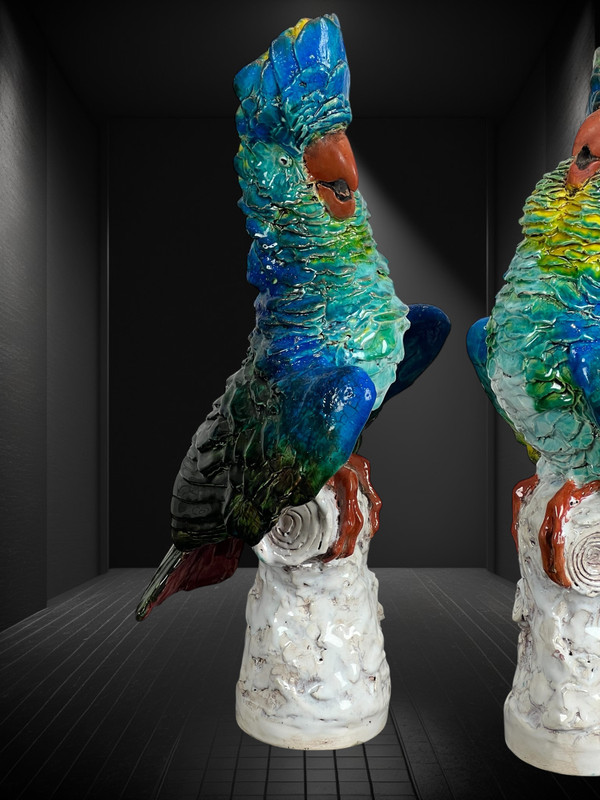 PAIR OF POLYCHROME GLAZED CERAMIC COCKATOOS BEARING A SIGNATURE