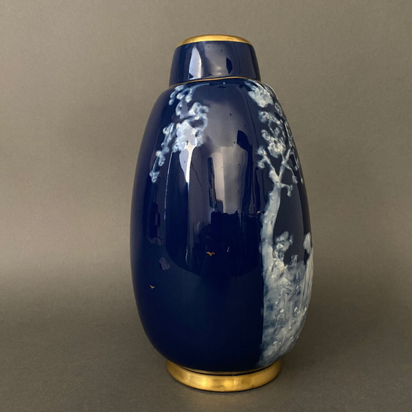 Marcel Chaufriasse Limoges porcelain vase with blue background