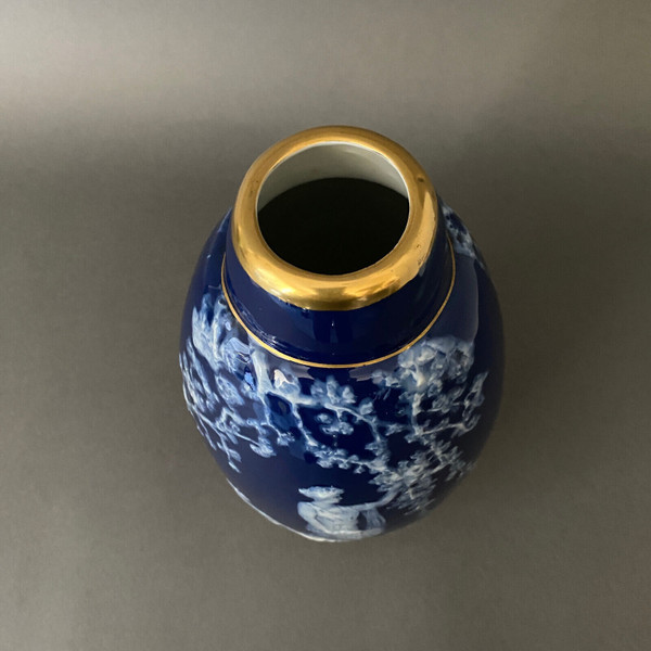 Marcel Chaufriasse Limoges porcelain vase with blue background