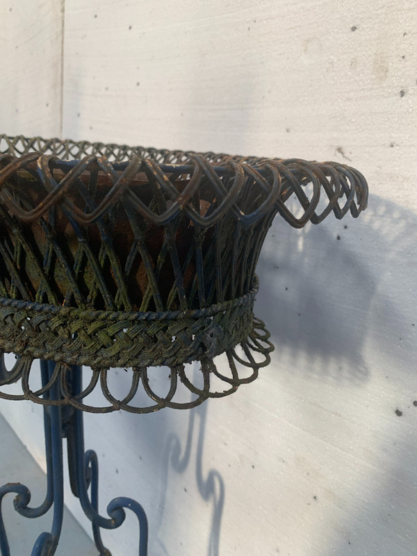 Oval planter on woven metal stand, 20th century