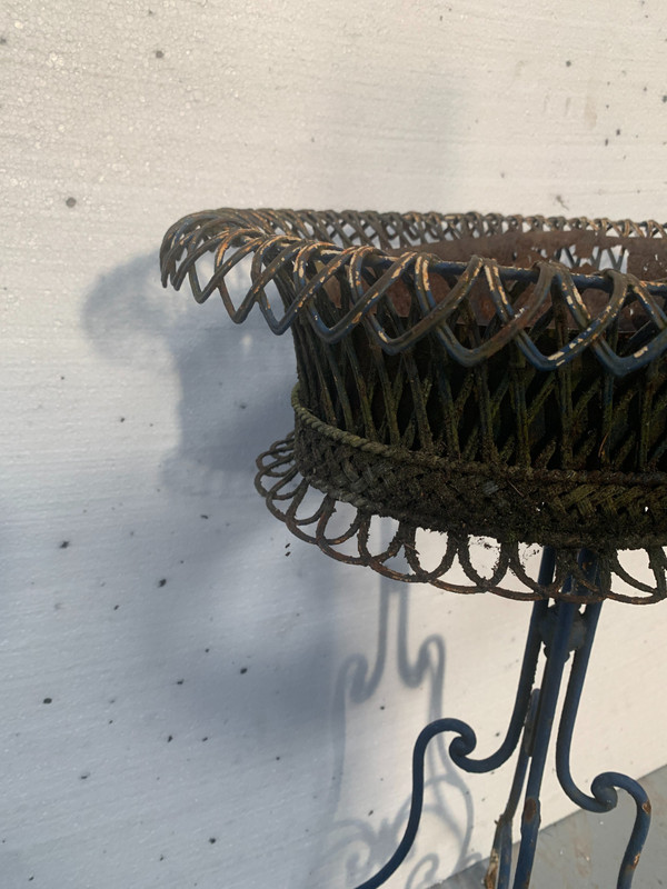 Oval planter on woven metal stand, 20th century